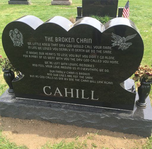 Black granite triple heart monument etched with angels and a verse