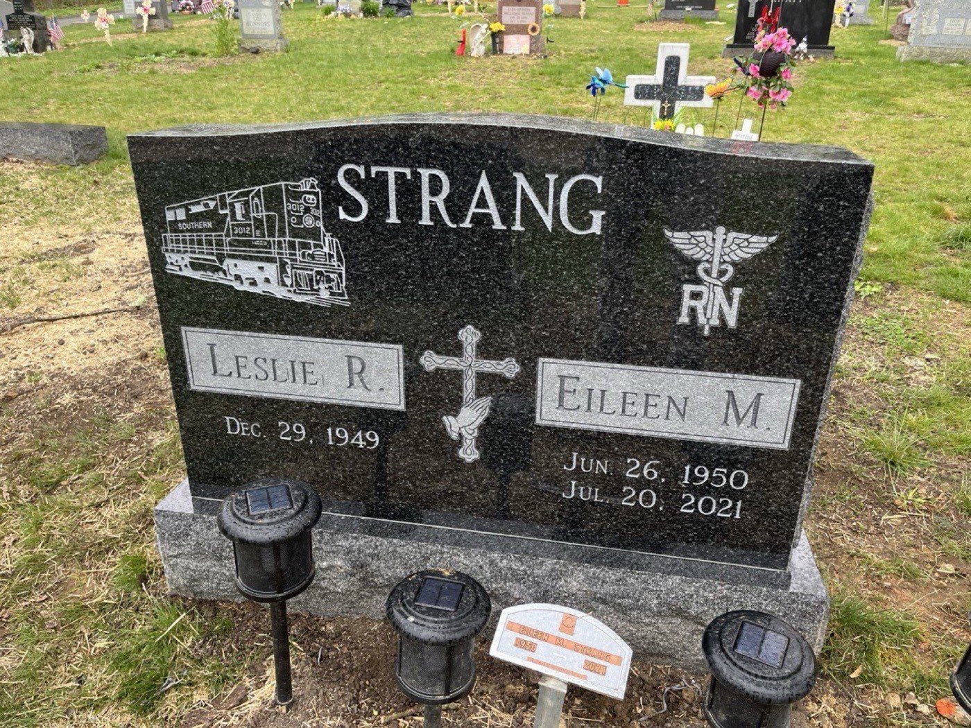 Black granite upright with a laser etched locomotive, a nursing caduceus and a Celtic cross